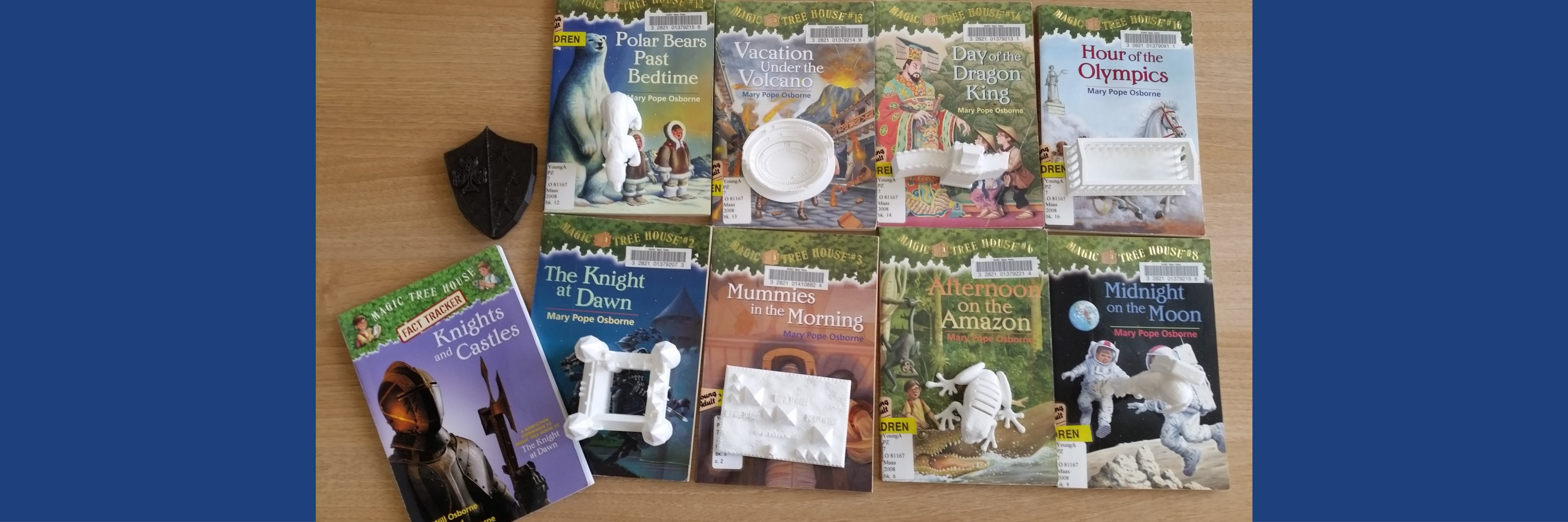 Magic Tree House books with 3D printed models of an object in the book 